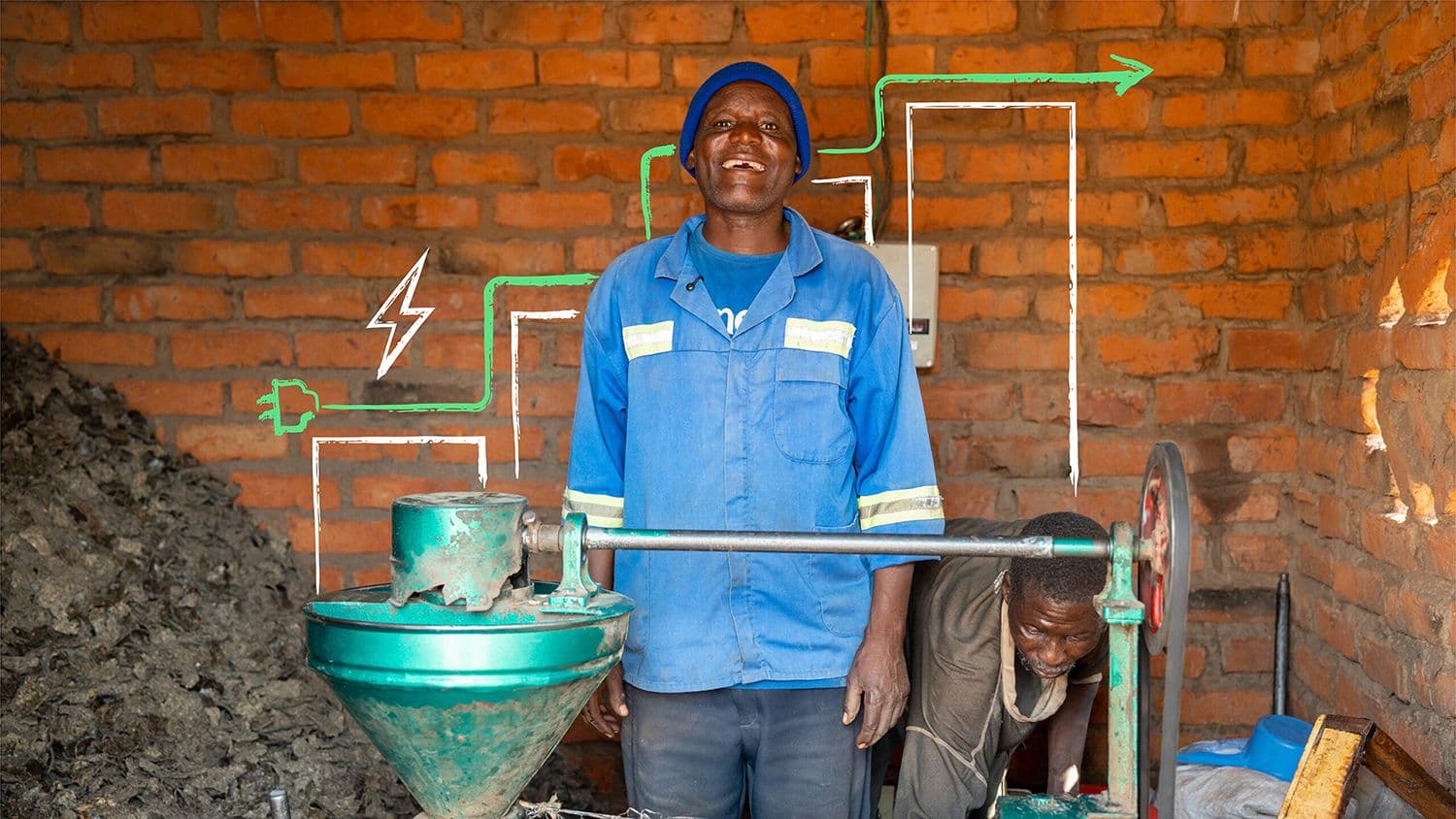 a worker in a blue uniform stands beside industrial energy equipment inside a brick workshop, with illustrated electricity and infrastructure graphics overlaid on the image.